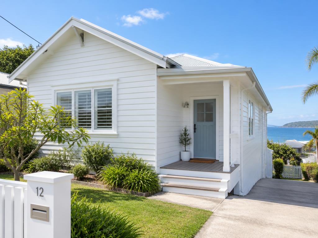 Freshly washed white weatherboard cottage