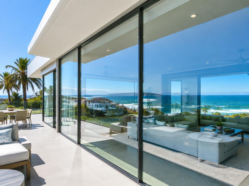 Spotless floor-to-ceiling windows on a coastal home